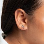 Cubic Zirconia stud with rhodium plating floral motif with dangling petal