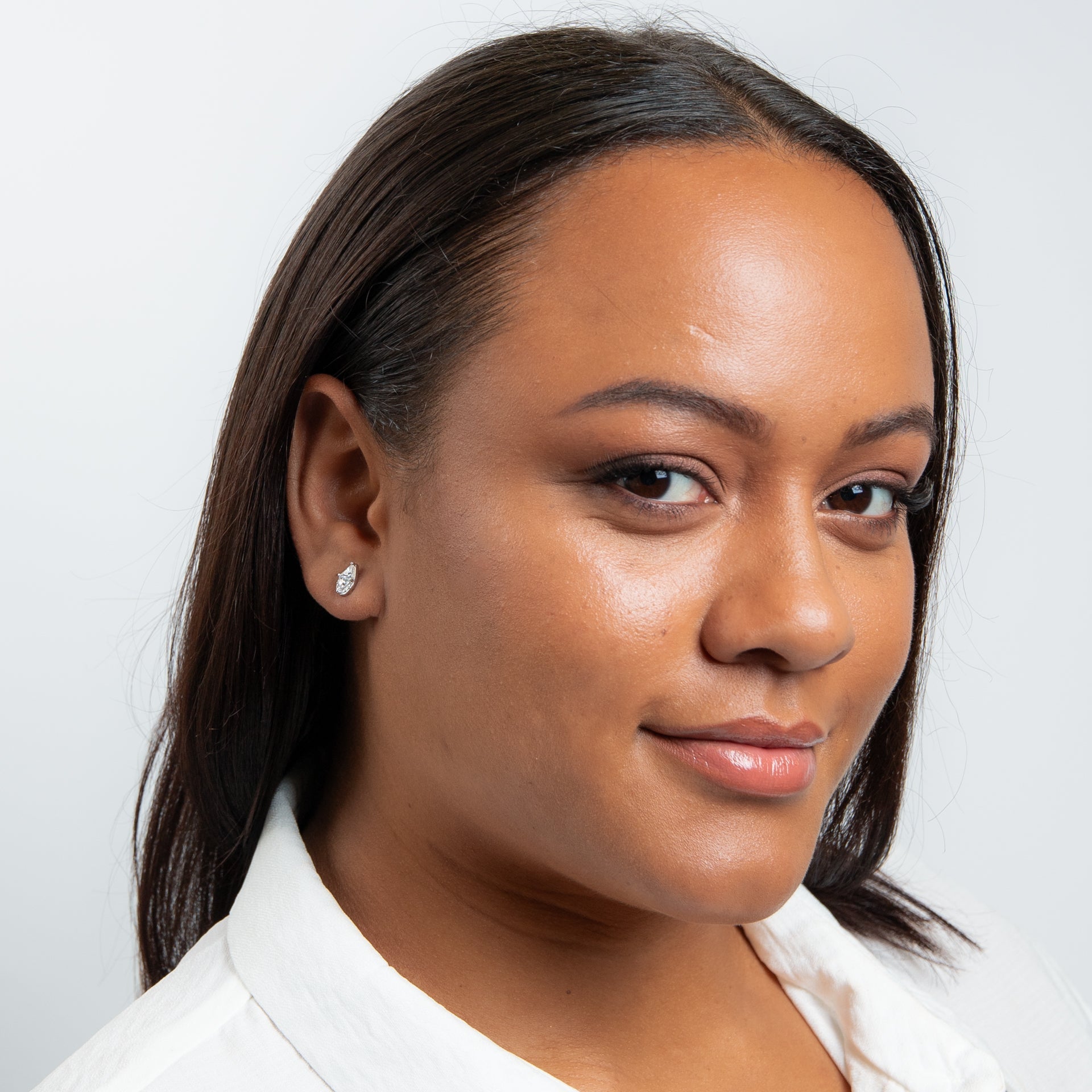 Cubic Zirconia stud with rhodium plating drop shape with pave and triangular stones