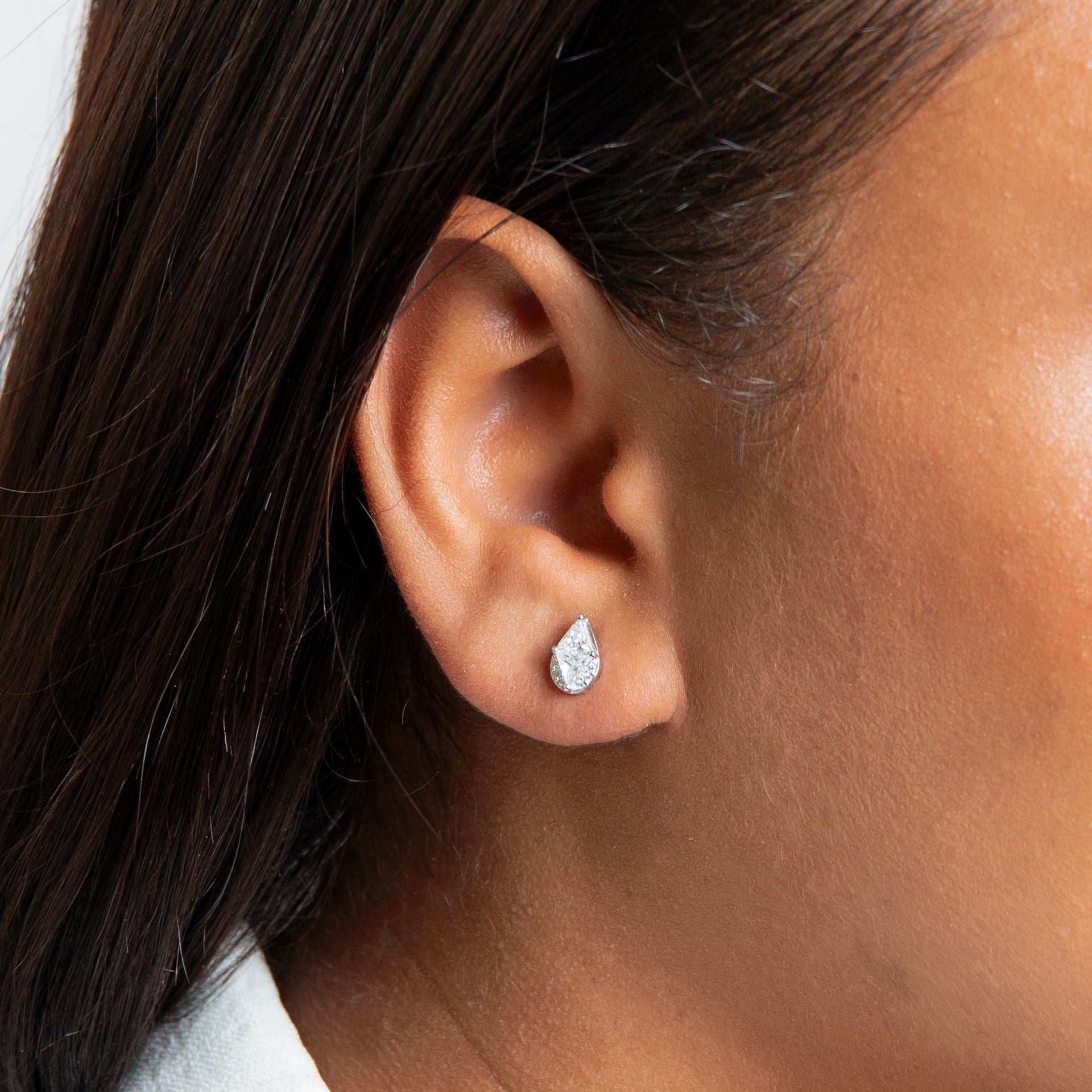 Cubic Zirconia stud with rhodium plating drop shape with pave and triangular stones