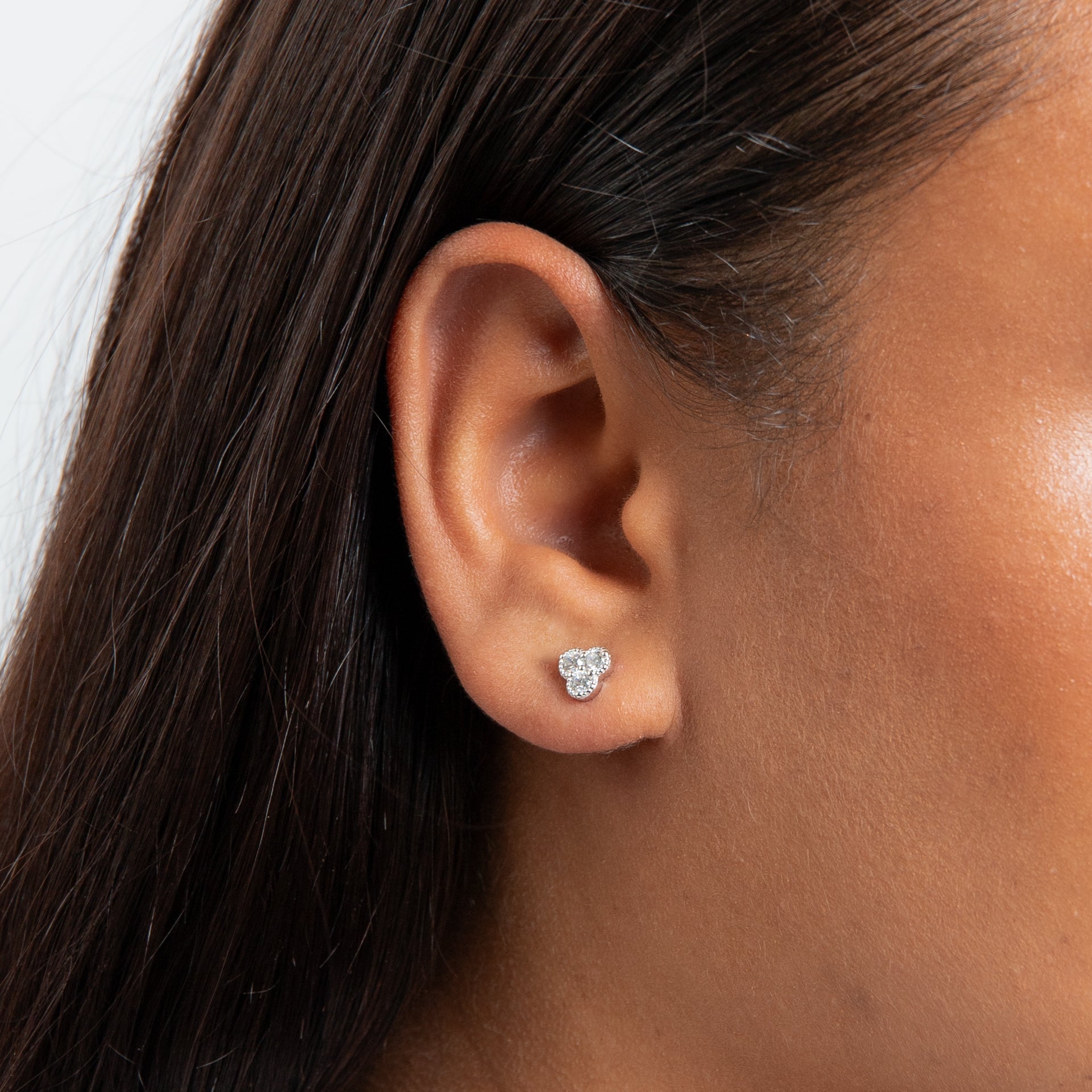 Cubic Zirconia stud with rhodium plating three stones with stippling edges