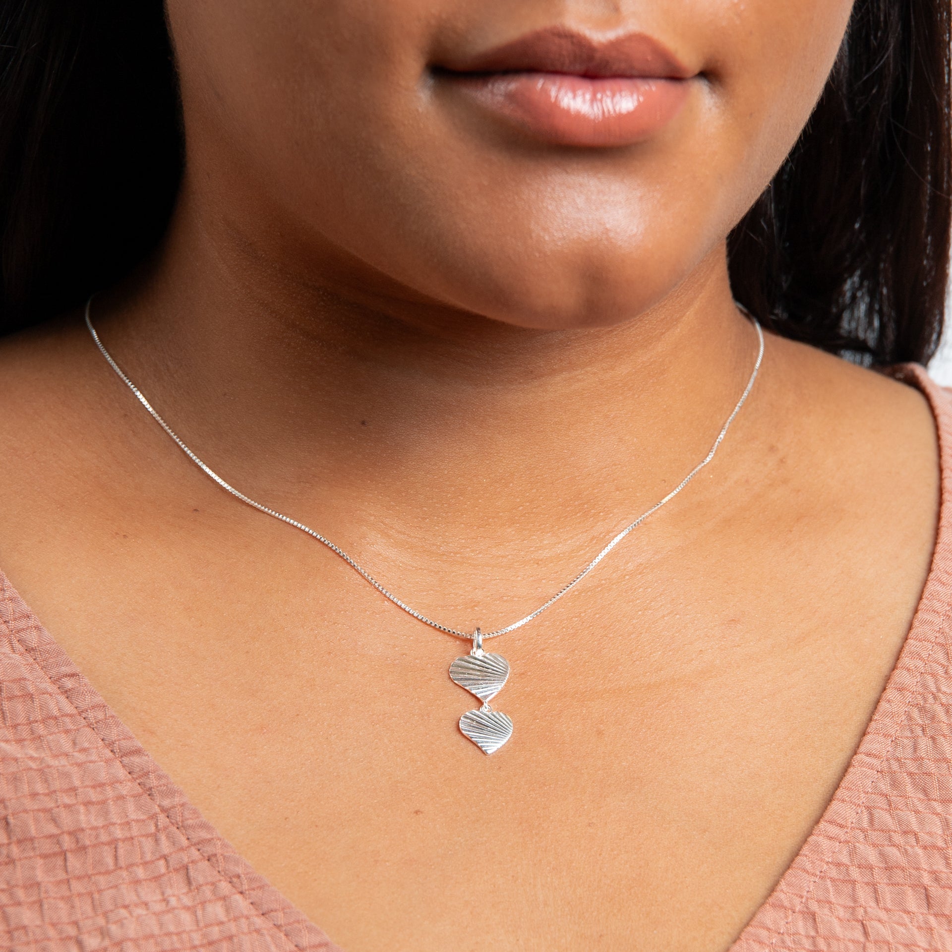 Diamond cut double heart pendant