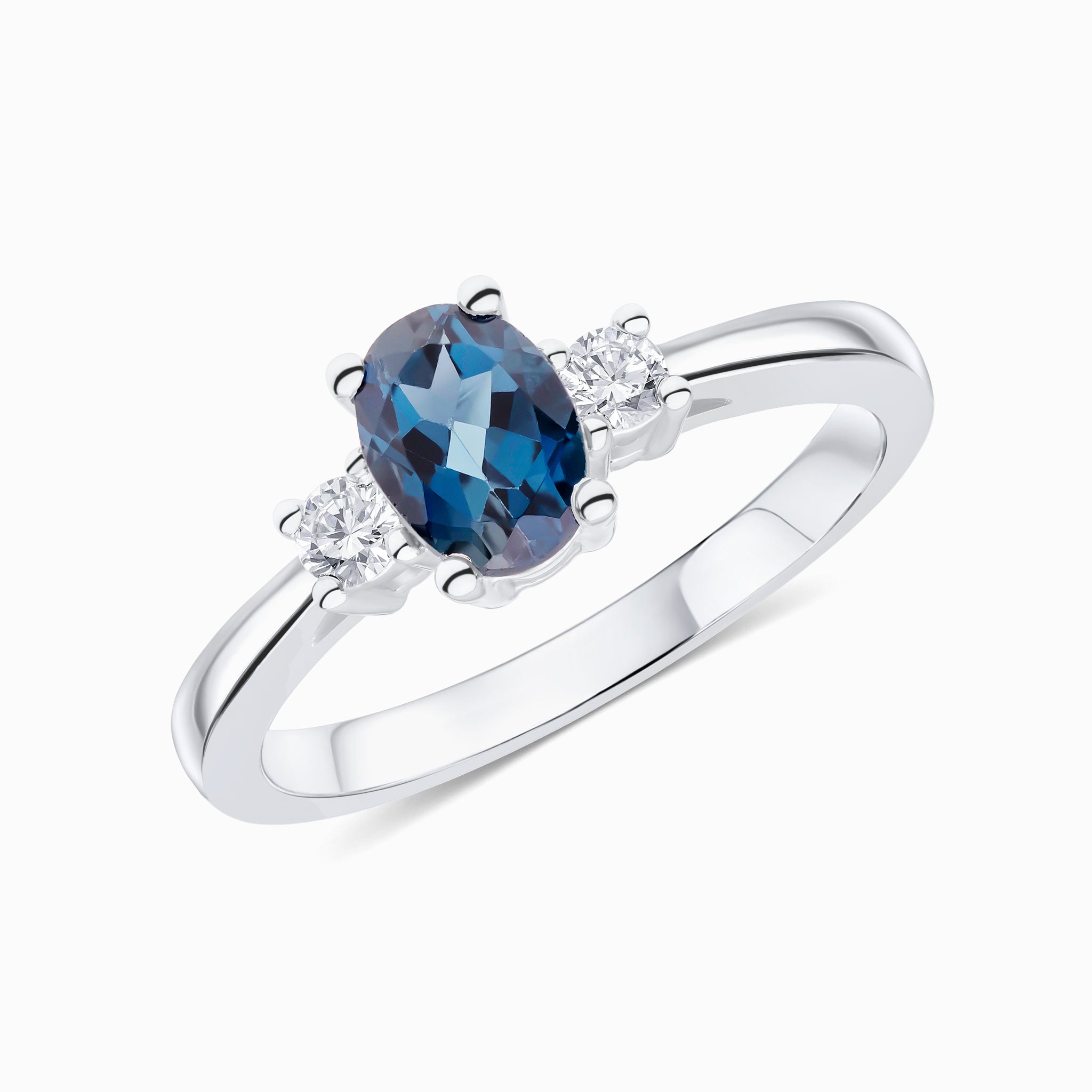 9CT WG 7X5 OVAL LONDON BLUE TOPAZ AND ROUND DIAMOND CLAW SET 3ST RING 1