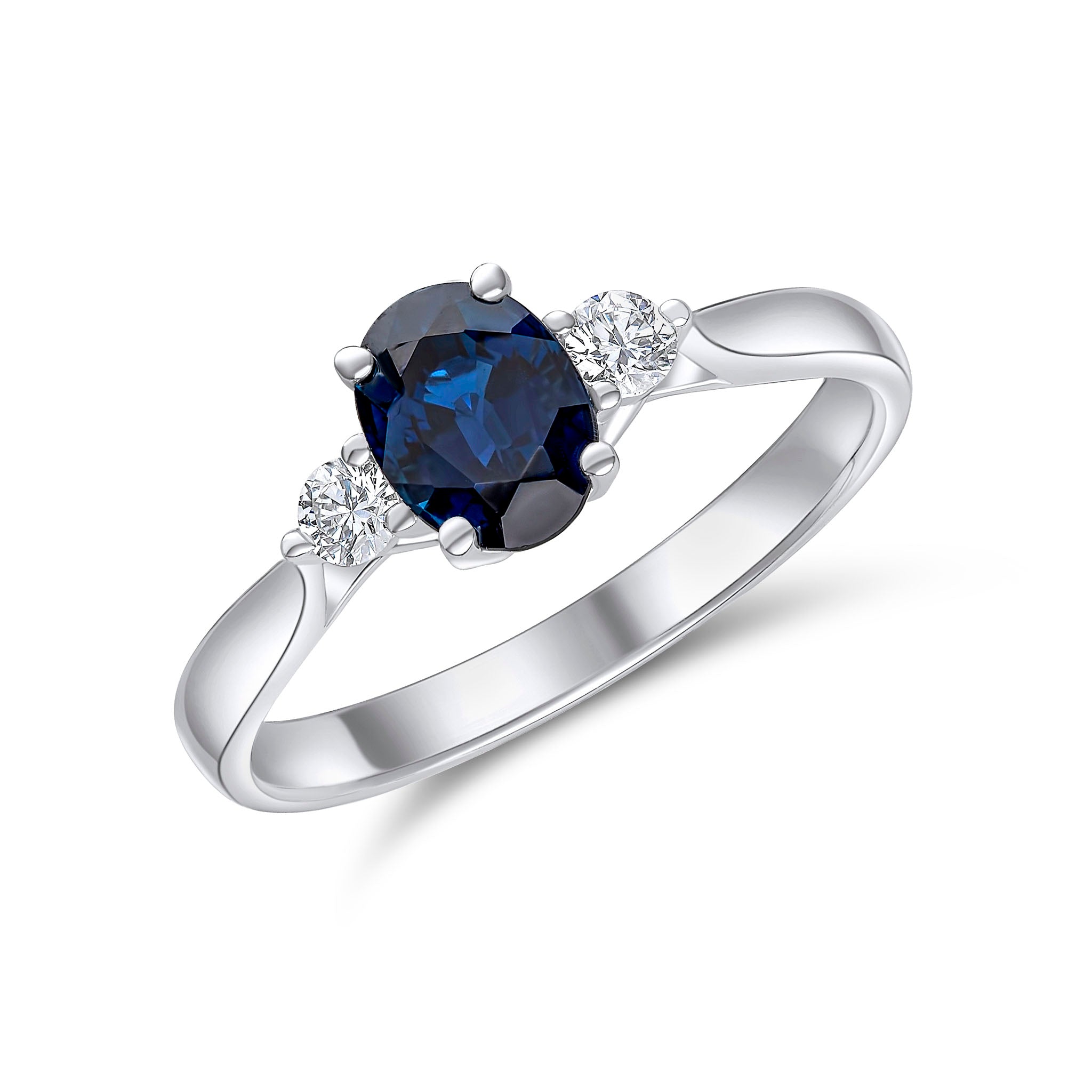 18wg 7x5 Oval Sapphire and Round Diamond Claw 3 Stone Ring